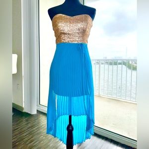 Sheer and sequence teal dress.